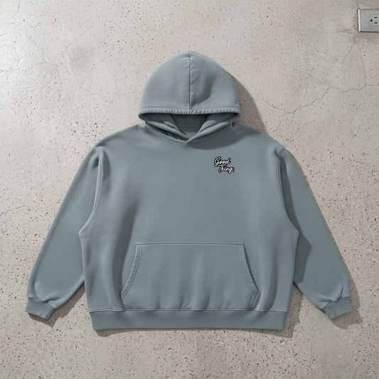 Good Thing & Co. heavyweight cotton hoodie in a muted blue vintage wash with a boxy fit and front patch pocket.