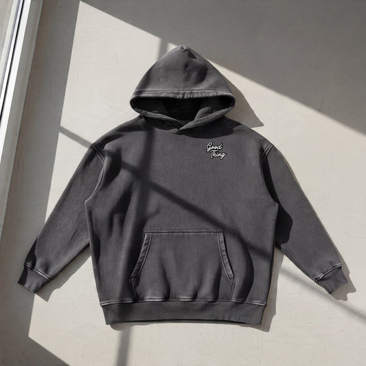 Good Thing & Co. charcoal grey oversized hoodie with a snow wash finish, drop shoulders, and front kangaroo pocket.