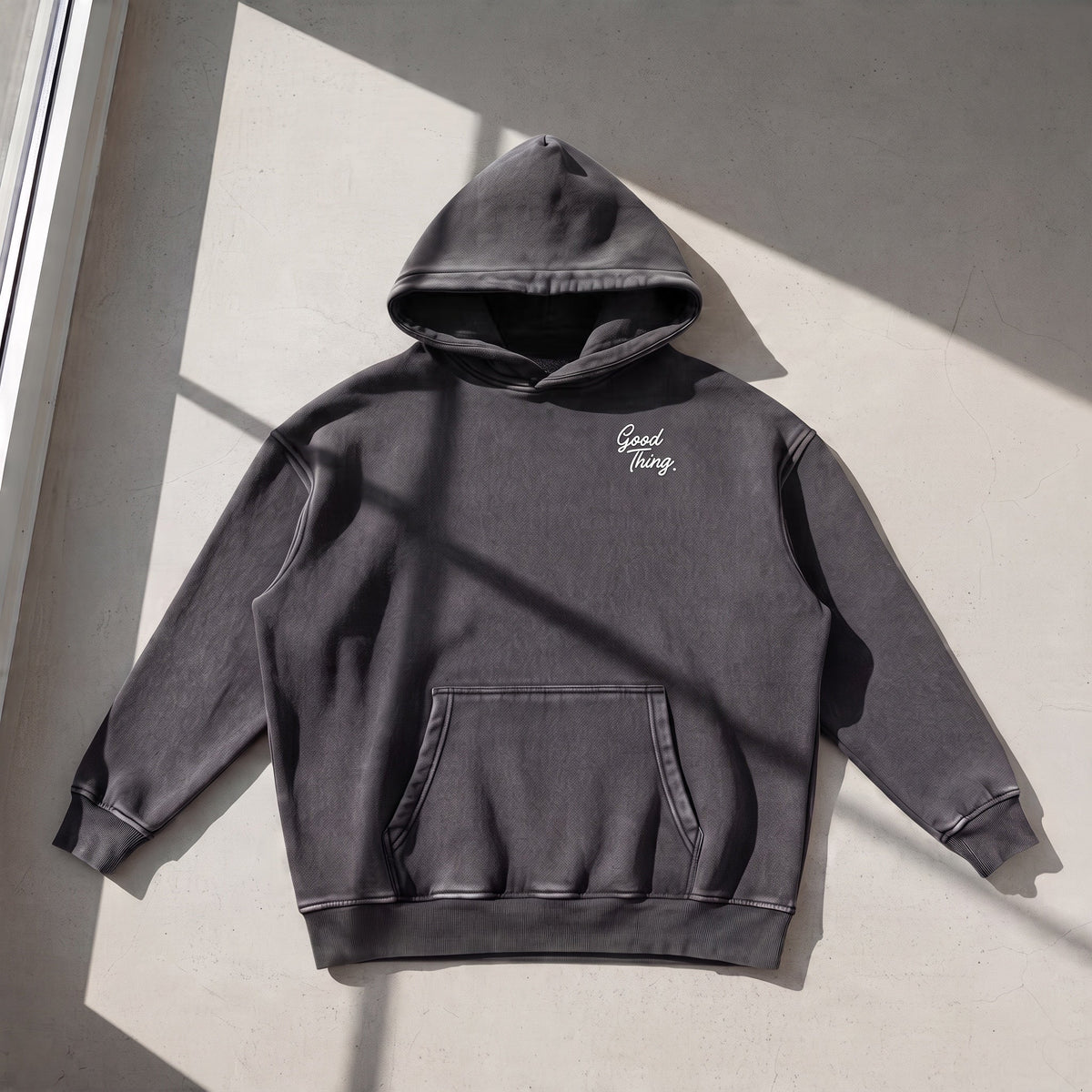 Good Thing & Co. charcoal grey oversized fleece hoodie with a snow wash finish and small white chest logo
