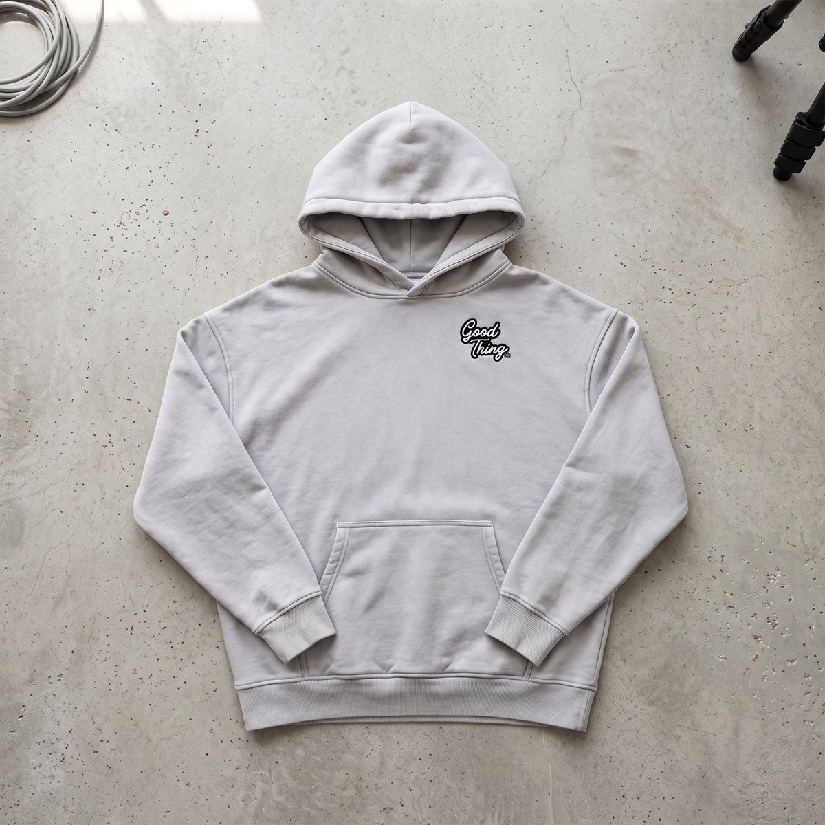 Good Thing & Co. grey oversized fleece hoodie with a snow wash finish, drop shoulders, and a small chest logo.