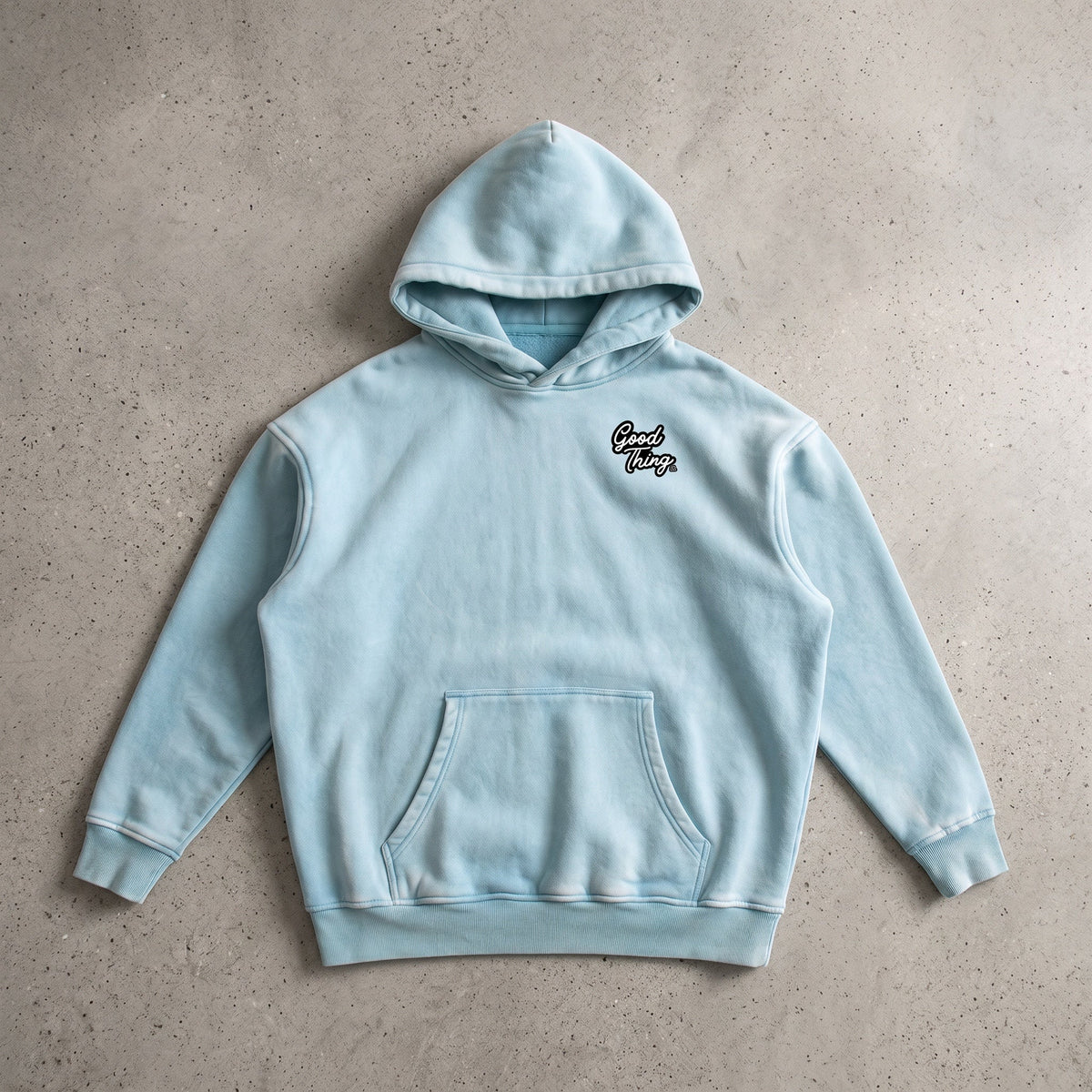 Good Thing & Co. light blue oversized fleece hoodie with a snow wash finish, drop shoulders, and front logo detail.